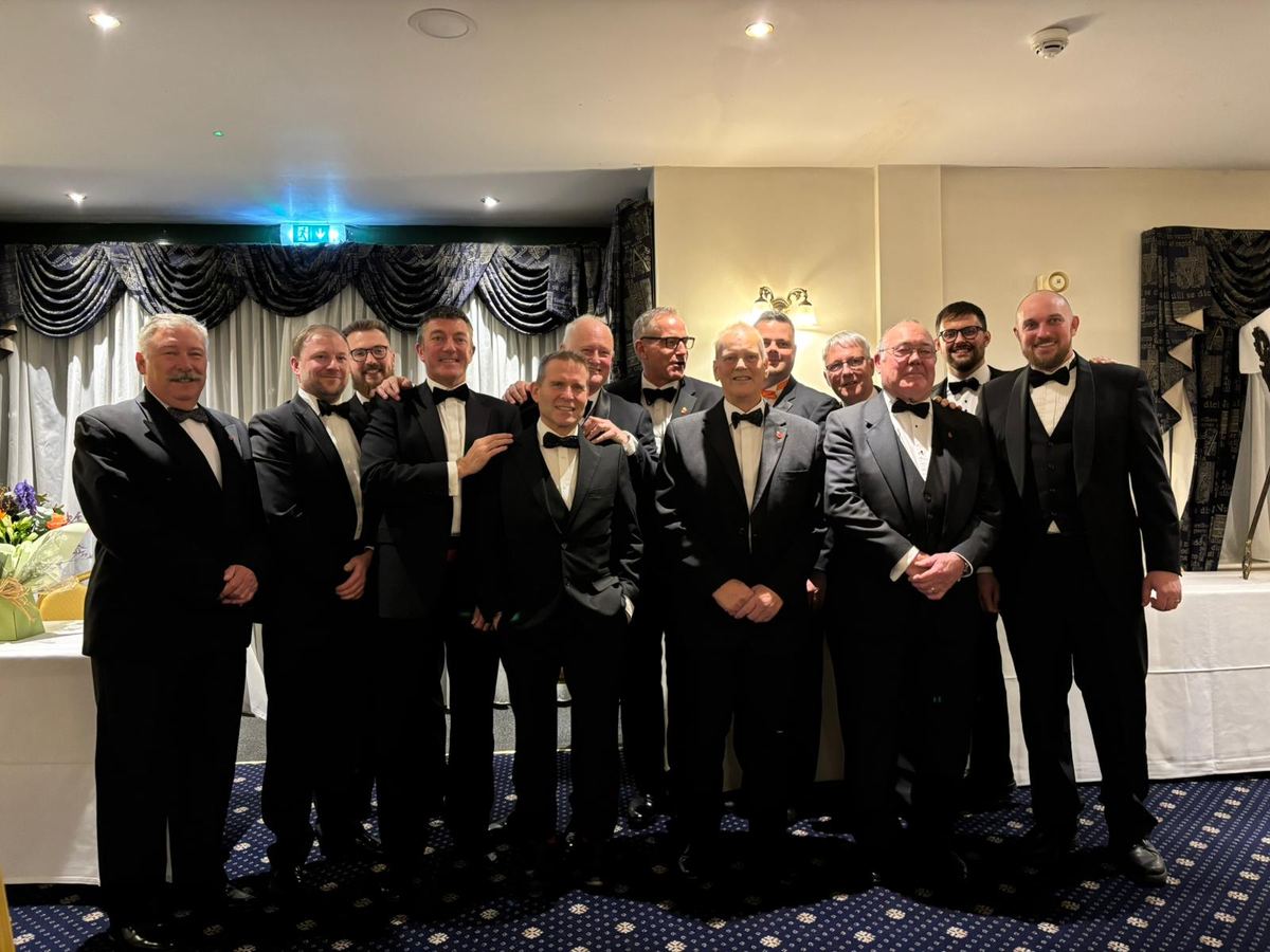 A group of members in black tie