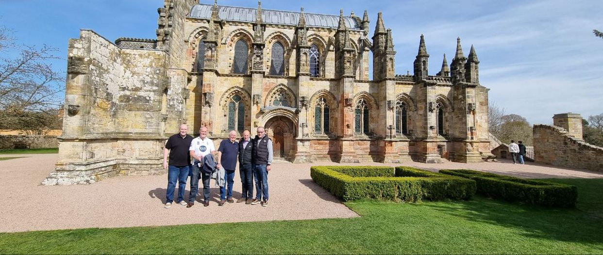 Members outside Rosslyn Chapel in the sunshine